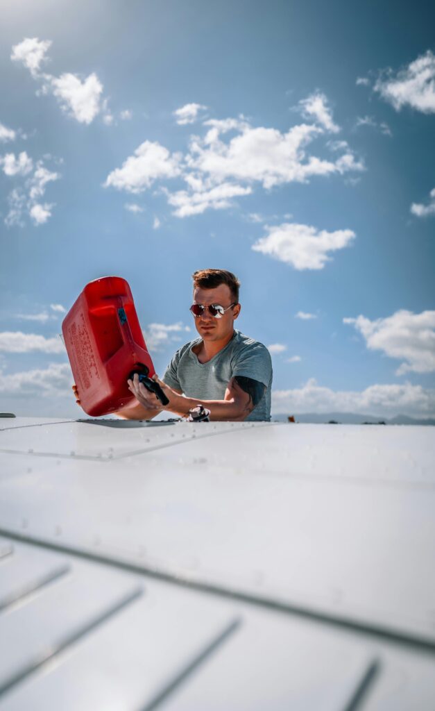 Picture of a person tipping gas out of a gallon jug for their semi-truck